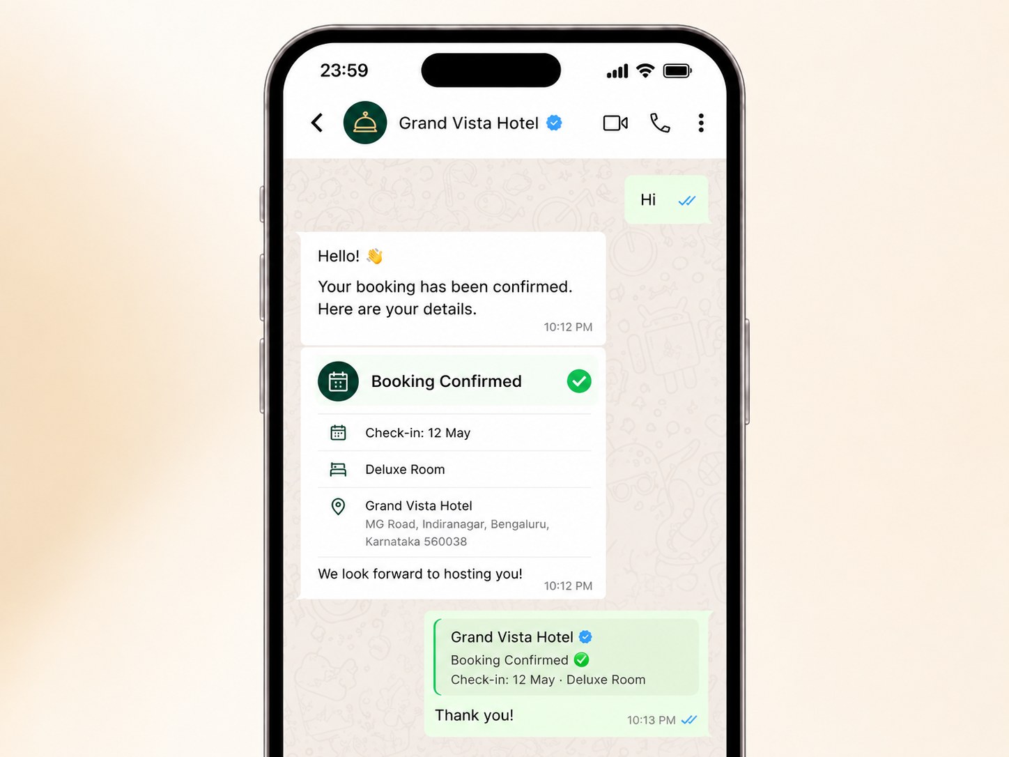 Phone showing a booking-confirmed WhatsApp card with check-in date and room type